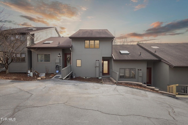 view of front of home with roof with shingles