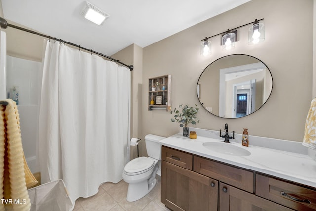 bathroom featuring a shower with shower curtain, toilet, vanity, and tile patterned flooring