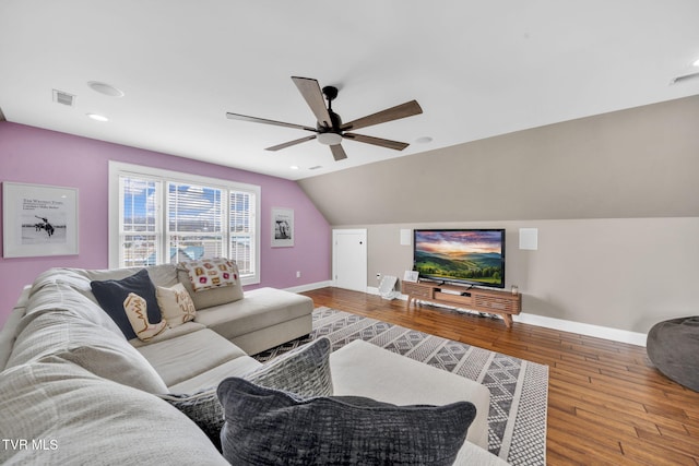 living room featuring a ceiling fan, lofted ceiling, wood finished floors, and baseboards