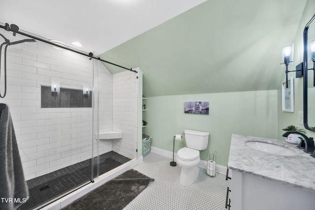 bathroom with vanity, baseboards, a stall shower, tile patterned floors, and toilet