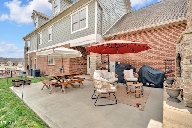 view of patio / terrace with a grill, outdoor lounge area, outdoor dining area, and central AC