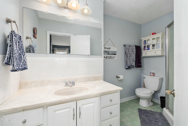 bathroom featuring vanity, a shower stall, tile patterned floors, toilet, and tasteful backsplash