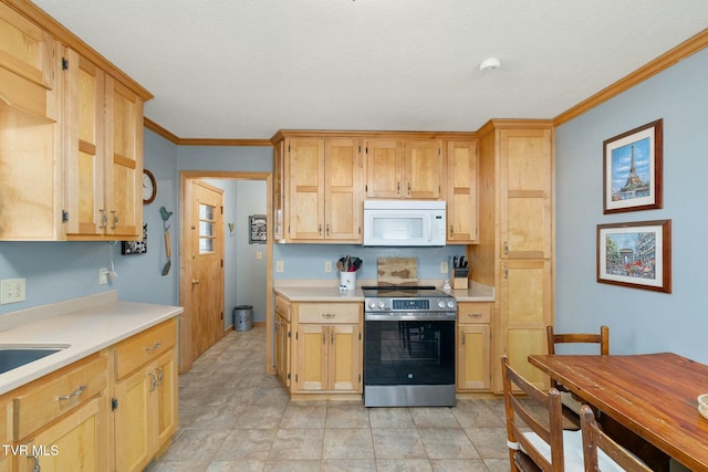 kitchen with white microwave, stainless steel range with electric cooktop, light countertops, and ornamental molding