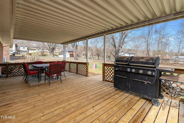 wooden deck featuring outdoor dining space and fence