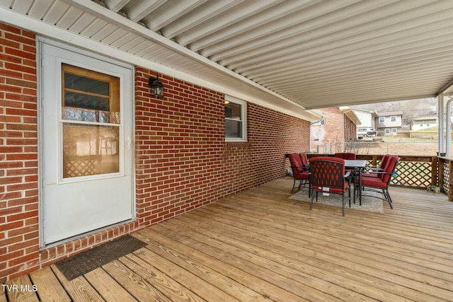 wooden terrace with outdoor dining space