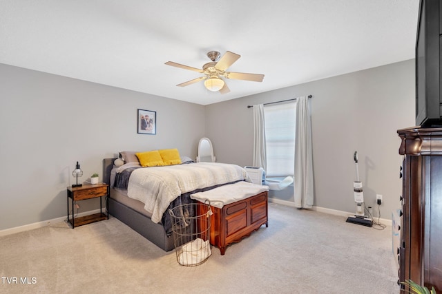 bedroom with baseboards, light carpet, and a ceiling fan