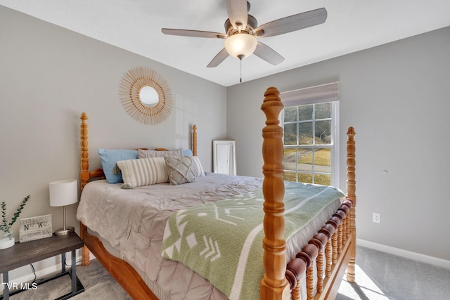 carpeted bedroom with baseboards and a ceiling fan