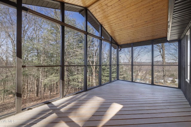 unfurnished sunroom with wooden ceiling and vaulted ceiling