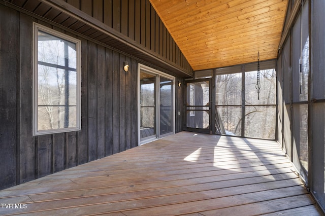 unfurnished sunroom with wood ceiling and vaulted ceiling