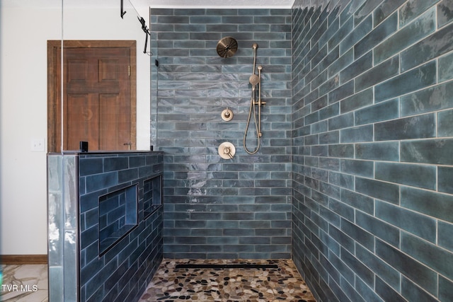 bathroom featuring tiled shower