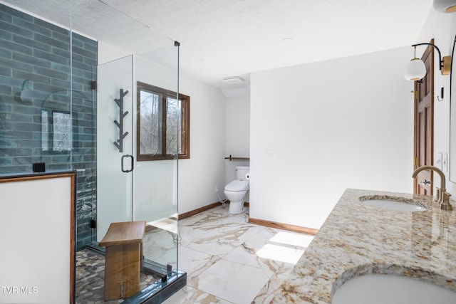 full bathroom with a shower stall, baseboards, marble finish floor, and a sink