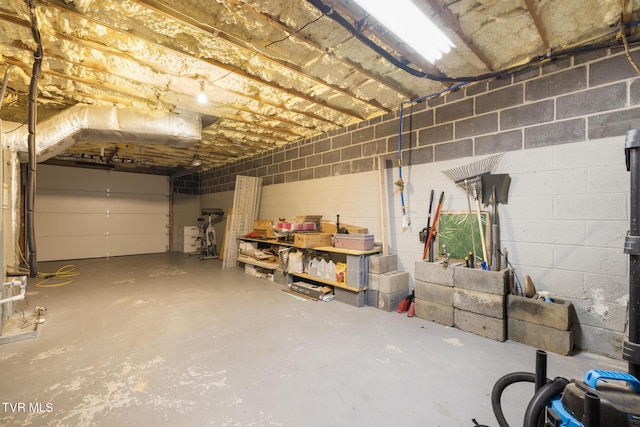 garage with concrete block wall