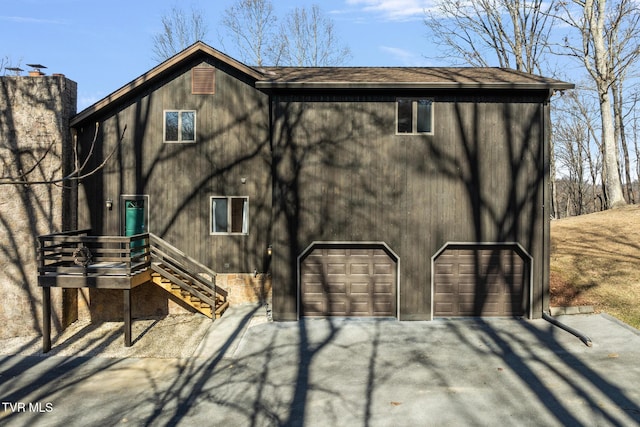 back of house with a garage