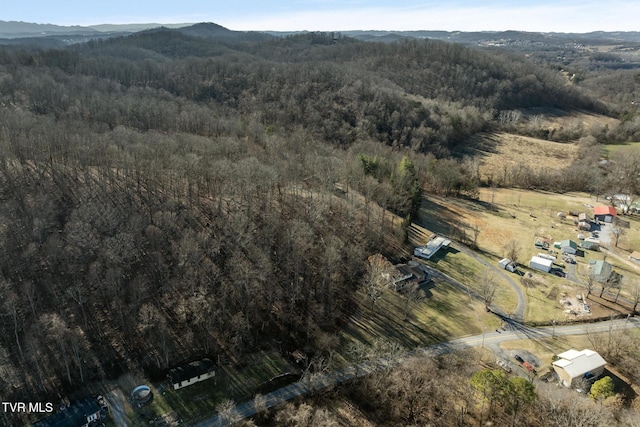 bird's eye view with a mountain view and a forest view