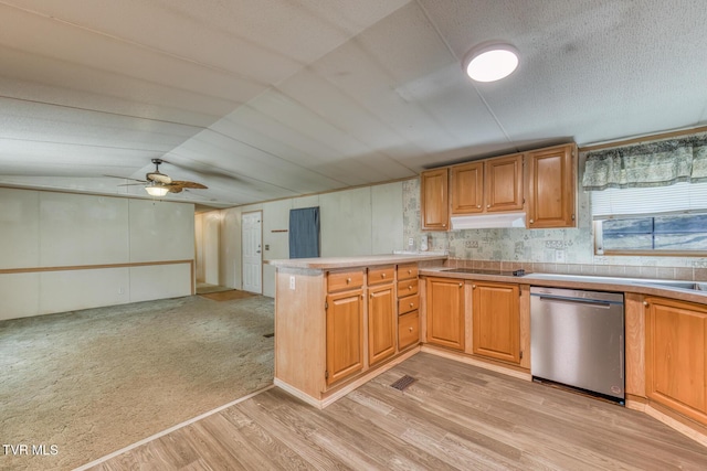 kitchen featuring under cabinet range hood, a textured ceiling, light wood-style floors, a peninsula, and dishwasher