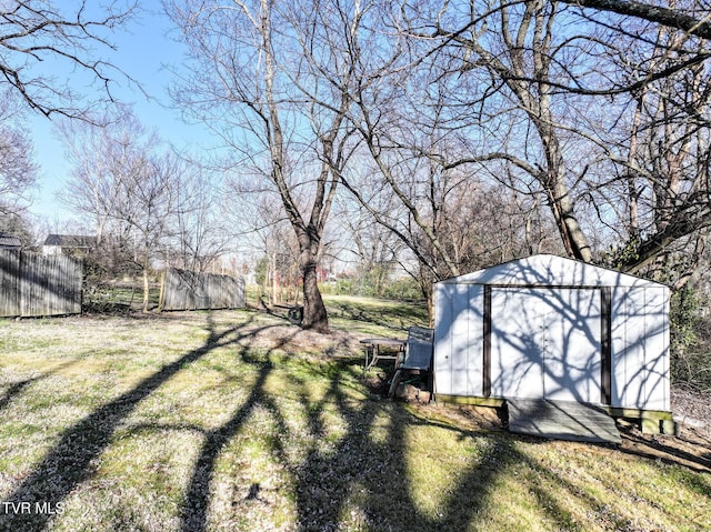 view of yard with a storage shed and an outdoor structure