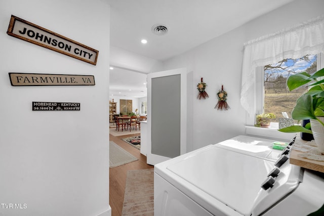 2256 Boones Creek Rd, Johnson City, TN 37615 - hallway featuring washer and dryer, visible vents, light wood-style flooring, and recessed lighting