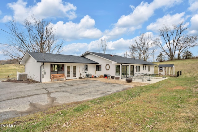 2256 Boones Creek Rd, Johnson City, TN 37615 - back of house with french doors, a patio, a yard, and central AC unit