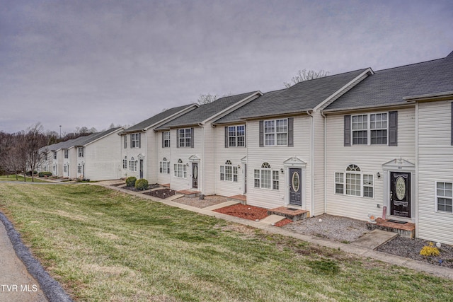 view of property with a residential view and a front yard