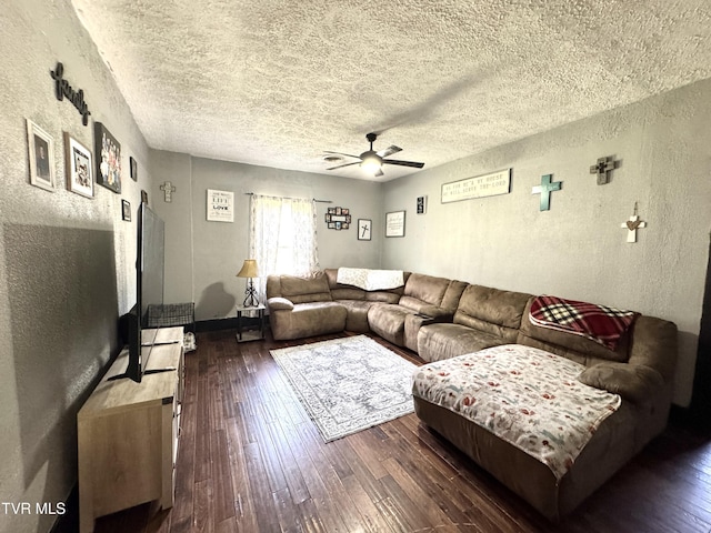 living area featuring a textured ceiling, hardwood / wood-style flooring, a textured wall, and ceiling fan