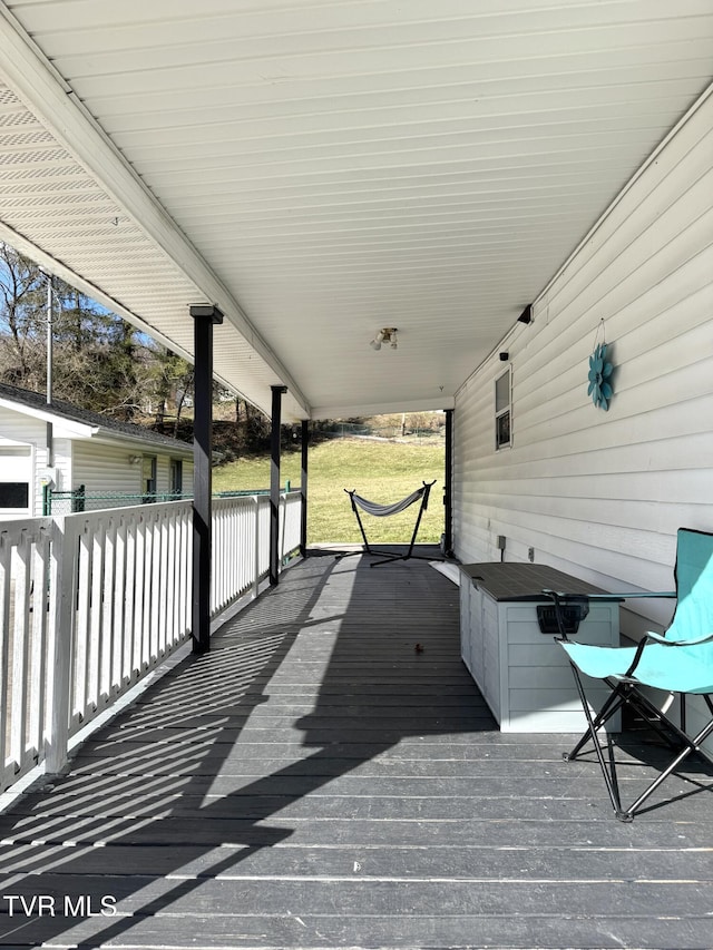 wooden terrace with a porch