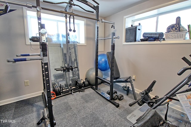 exercise room with baseboards