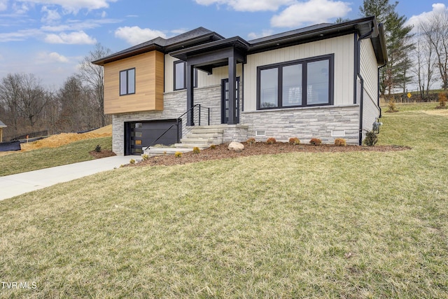 view of front facade with a front yard, concrete driveway, a garage, stone siding, and crawl space