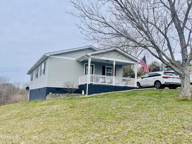 view of front of home with a porch and a front lawn