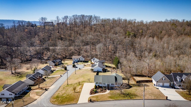 aerial view featuring a wooded view