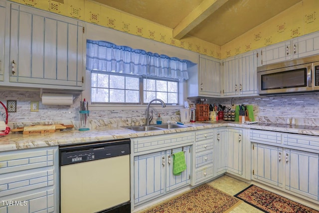 kitchen featuring black electric cooktop, a sink, lofted ceiling with beams, stainless steel microwave, and dishwashing machine