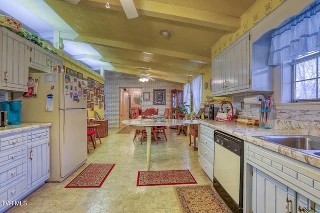 kitchen with a ceiling fan, lofted ceiling with beams, freestanding refrigerator, light countertops, and dishwasher