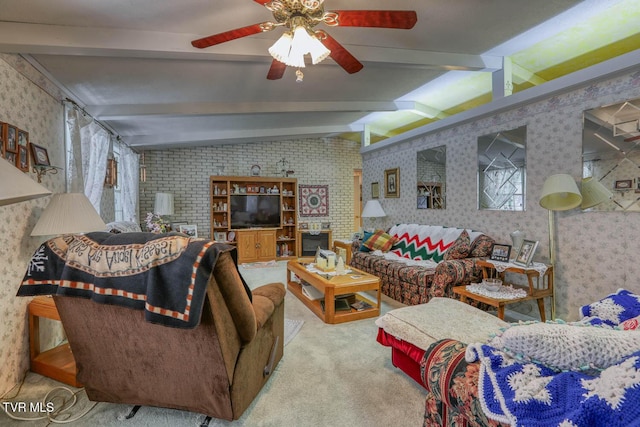 carpeted living area with wallpapered walls, lofted ceiling with beams, and ceiling fan