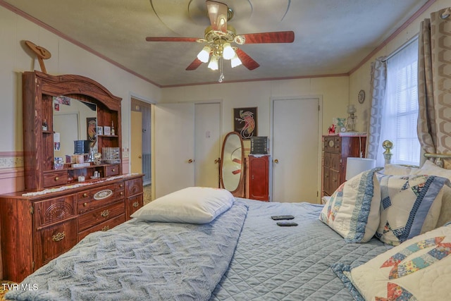 bedroom featuring crown molding and a ceiling fan