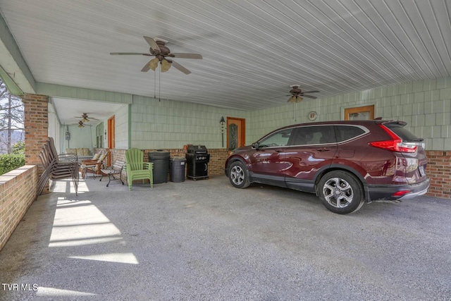 view of patio featuring a carport, a grill, and a ceiling fan