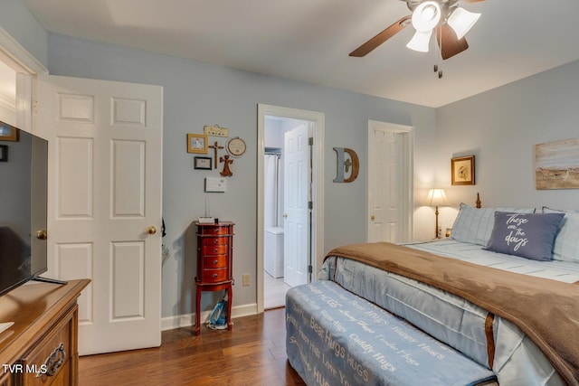 bedroom with a ceiling fan, ensuite bathroom, baseboards, and wood finished floors