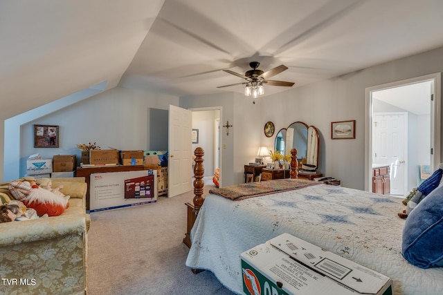 carpeted bedroom featuring ensuite bathroom, ceiling fan, and vaulted ceiling