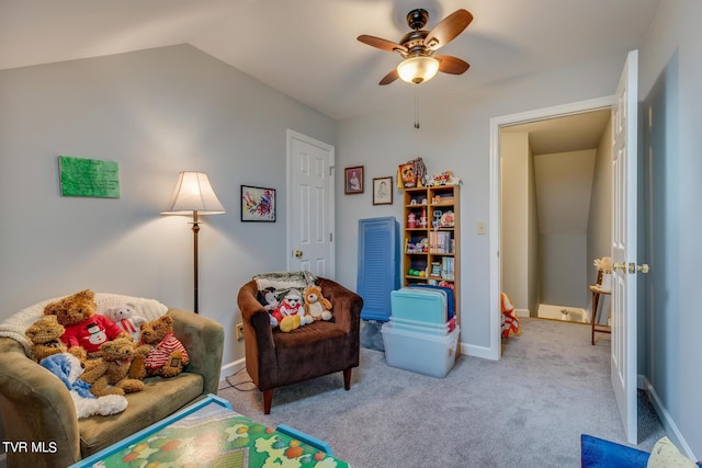 recreation room featuring ceiling fan, baseboards, lofted ceiling, and carpet