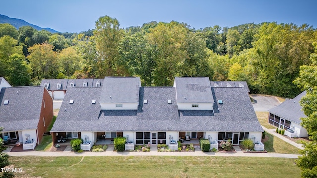 drone / aerial view with a view of trees