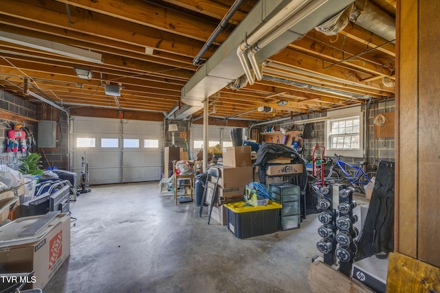 garage with electric panel and a garage door opener