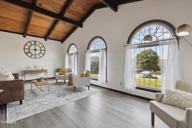 living room with wood finished floors, baseboards, high vaulted ceiling, wood ceiling, and beamed ceiling