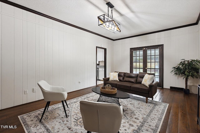 living room featuring french doors, dark wood finished floors, and ornamental molding