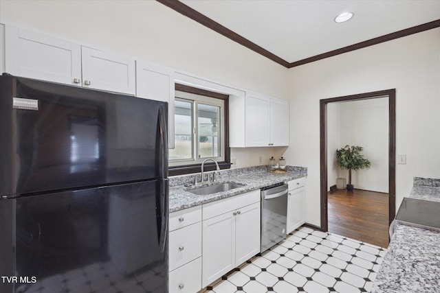 kitchen with ornamental molding, a sink, freestanding refrigerator, light floors, and dishwasher