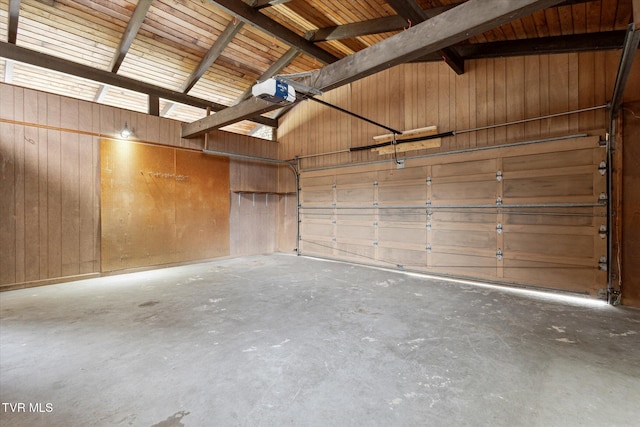 garage featuring metal wall and a garage door opener