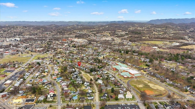 birds eye view of property with a mountain view