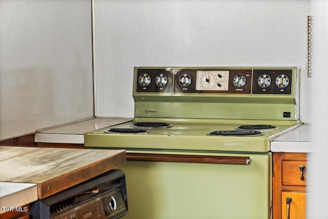 kitchen featuring light countertops and electric range oven