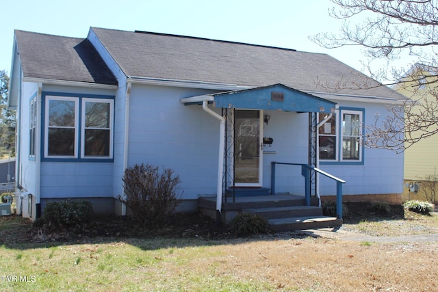 view of front of home with roof with shingles