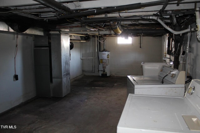 below grade area with heating unit, independent washer and dryer, and gas water heater