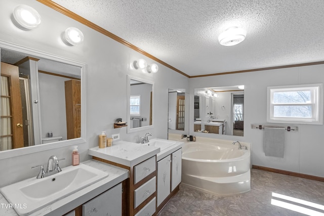 full bath with a textured ceiling, a garden tub, ornamental molding, and a sink