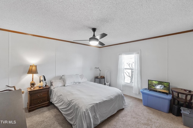 bedroom with a textured ceiling, crown molding, and carpet floors