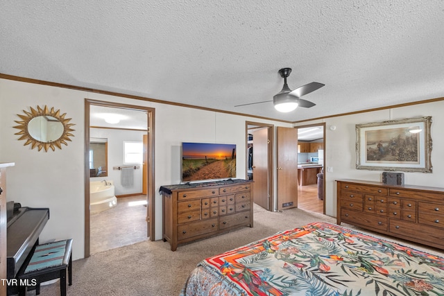 bedroom featuring a ceiling fan, a textured ceiling, ensuite bath, crown molding, and light colored carpet